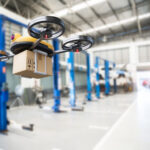 Spare_part_delivery_drone_at_garage_storage_in_leading_automotive_car_service_center_for_delivering_mechanical_shipping_component_part_assembling_to_customer._Modern_innovative_technology_and_gadget