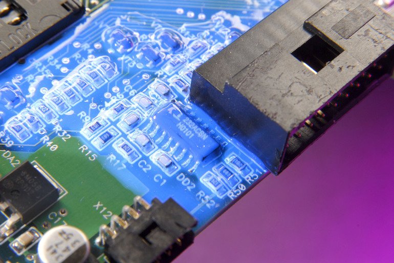 Low viscosity conformal coating cures with light