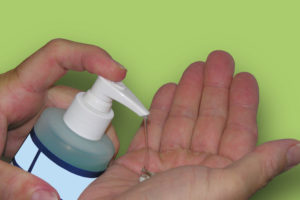 Using hand sanitizer