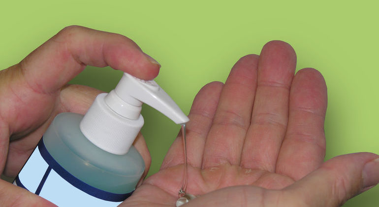 Using hand sanitizer